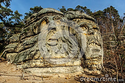 Two giant heads of devils carved into sandstone rocks,each is about 9m high.Devils Heads created by Vaclav Levy near Libechov, Editorial Stock Photo