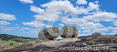 two giant rocks on top of a mountain. Blue sky with clouds in the background. Cabeceiras, Paraiba, Northeast Brazil Stock Photo