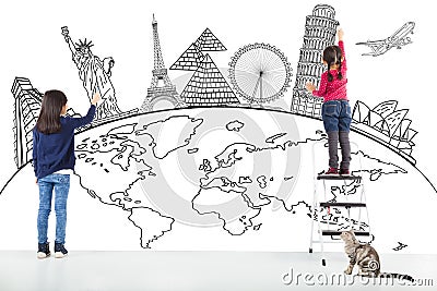 Two girl kids drawing global map and famous landmark Stock Photo