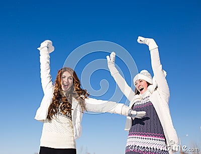 Two girlfriends have fun at winter day Stock Photo