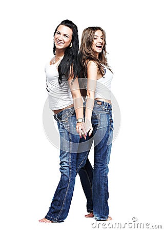 Two girlfriends wearing blue jeans on white Stock Photo