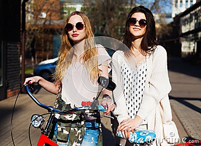 Two Girls on a bicycle. Outdoor Stock Photo