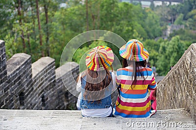 Two girls on the city wall Editorial Stock Photo