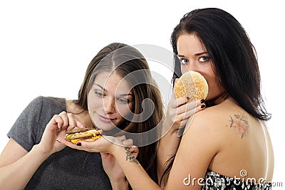Two girls divide one sandwich Stock Photo