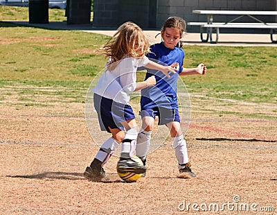 Two Girls Fighting for the Ball/Soccer Editorial Stock Photo