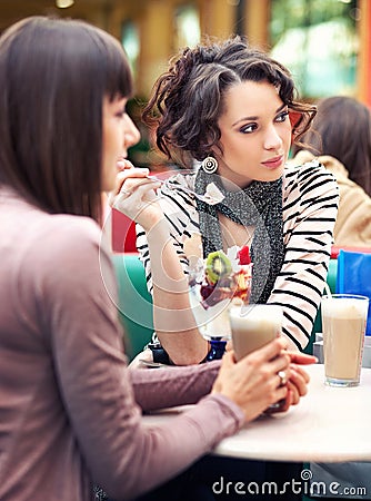 Two girls gossip Stock Photo