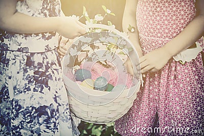 Two Girls Hands Holding an Easter Basket - Retro Stock Photo
