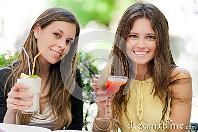 Two girls having an aperitif outdoor Stock Photo