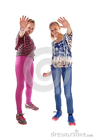 Two girls holding there hands up. Stock Photo