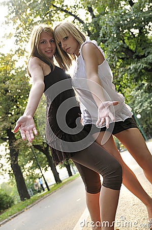 Two girls outside ready for party Stock Photo