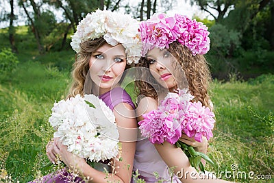Two girls with rose peony wreath Stock Photo
