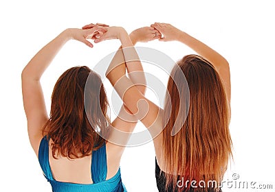 Two girls with there hands up. Stock Photo