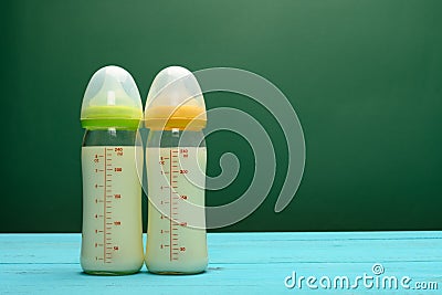 glass baby bottles with powdered milk with copy space Stock Photo