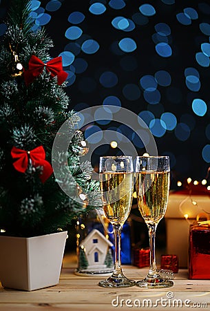 Two Glass Of Champagne Beside Christmas Tree Stock Photo