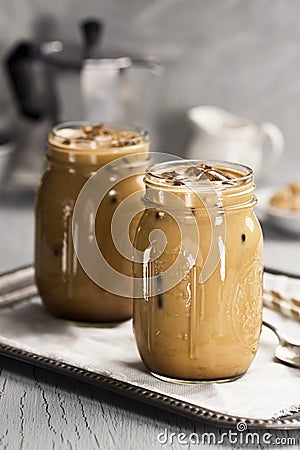 Two Glass Jars of Iced Coffee with Cream Stock Photo