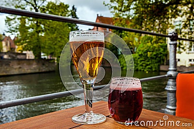 Two glasses of belgian beer standing on the table Stock Photo