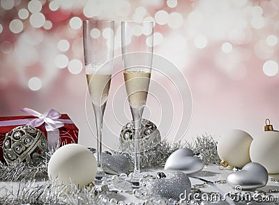 two glasses of champagne for christmas celebration with red decoration and gift Stock Photo