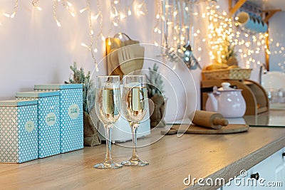 Two glasses of champagne on a kitchen. Christmas New year background and decoration Stock Photo