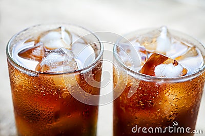 Two glasses of cola with ice. Close-up of a refreshing drink Stock Photo