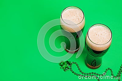 Two glasses of dark stout beer and traditional clover shaped decor Stock Photo