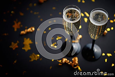 Two glasses full of sparkling champagne wine with golden decoration Stock Photo