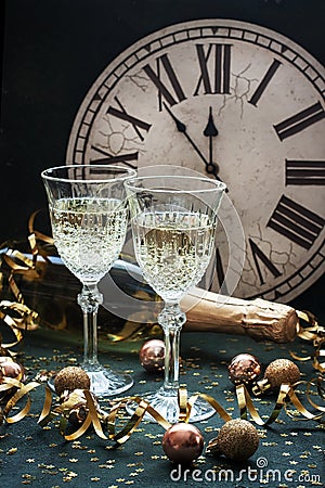 Glasses of champagne with bottle on color background, selective focus Stock Photo