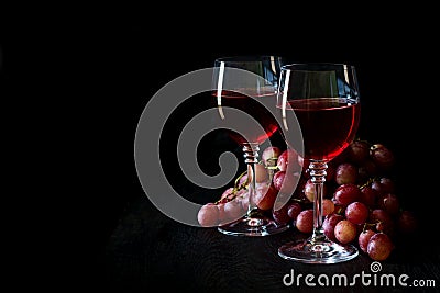 Two glasses of homemade rose wine and grapes Stock Photo