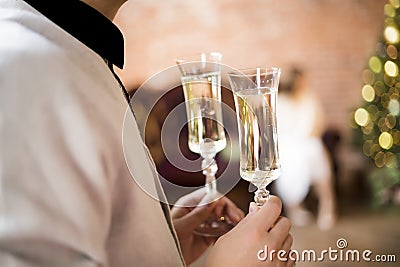 Two glasses with sparkling wine in male hands Stock Photo