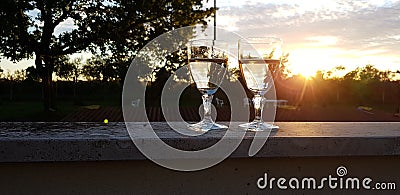Two glasses of wine on sunset Stock Photo