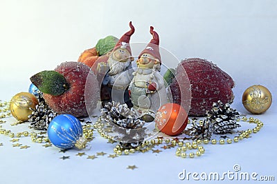 Two gnomes, apples and balls. Stock Photo