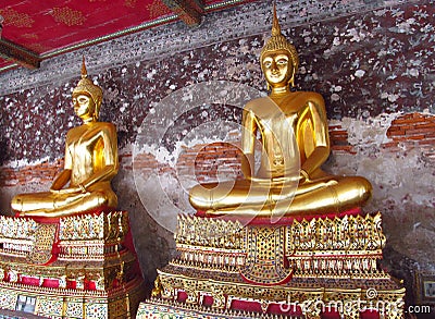 Two Gold-colored Buddha statue in Buddhist temple Stock Photo