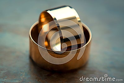 Two gold wedding rings lie on the table. horizontal frame Stock Photo