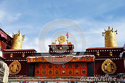 Two golden deer flanking a Dharma wheel on Jokhang Editorial Stock Photo