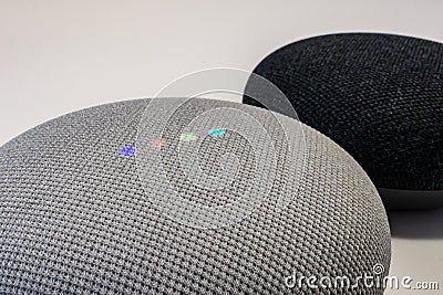 Two Google Nest Mini smart speakers up close Editorial Stock Photo