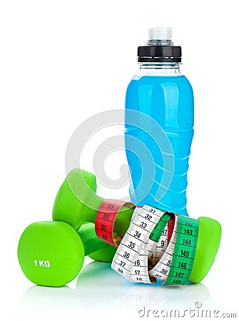 Two green dumbells, tape measure and drink bottle. Fitness and h Stock Photo