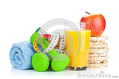 Two green dumbells, tape measure and healthy food. Fitness and h Stock Photo