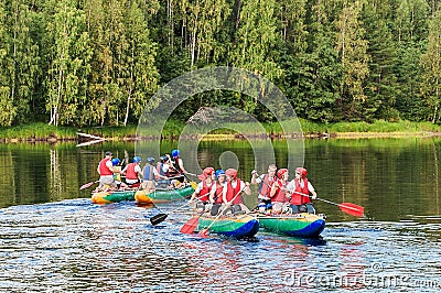 Two groups of students on catamarans in Karelia Editorial Stock Photo