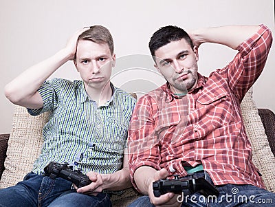 Two guys playing video games Stock Photo
