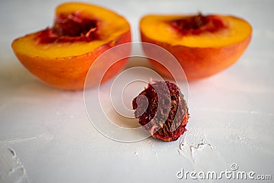 two half peaches on a white background l Stock Photo