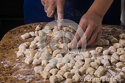 Some hands making gnocchi. traditional italian dish Stock Photo