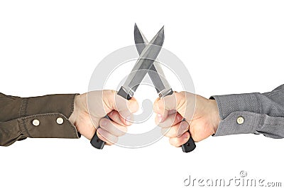 Two hands with knives facing each other. Confrontation and war Stock Photo