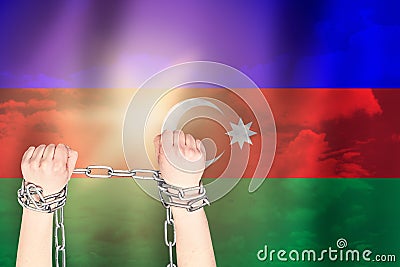 Two hands shackled a metal chain on the background of the Azerbaijan flag. Freedom concept Stock Photo
