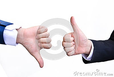 Two hands signalling thumbs up and thumbs down Stock Photo