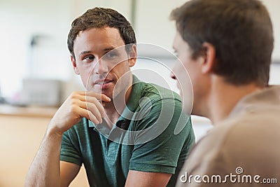 Two handsome mature students having a conversation Stock Photo