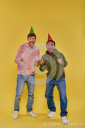 two handsome multiracial men in birthday Stock Photo