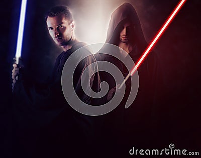 Two handsome warrior holding a light saber Stock Photo