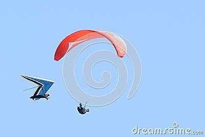 Two hang gliders fly close to each other Stock Photo