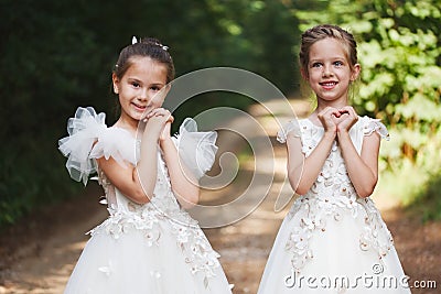 Happy beautiful girls with white wedding dresses Stock Photo