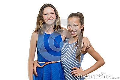 Two happy beautiful young girls friends embracing, with perfect white smile, isolated on white background Stock Photo