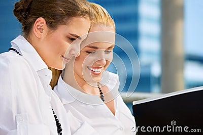 Two happy businesswomen with documents Stock Photo